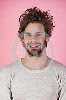 Sleepy man with beard on pink background