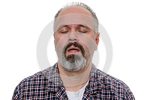 Sleepy man with beard and plaid shirt snores