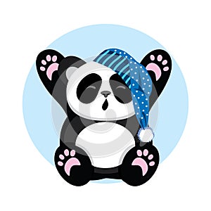 Sleepy Panda in the cap yawns and stretch oneself. photo