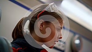 Sleepy paramedic sitting in emergency car. Female medical worker feeling tired