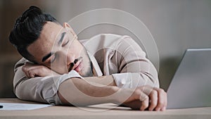 Sleepy unproductive man office male worker businessman falling asleep at office desk tired multiracial student closed