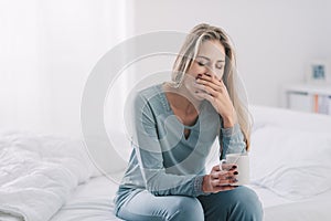 Sleepy woman having a coffee