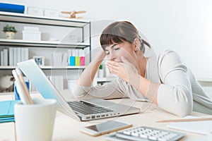 Sleepy woman in the office