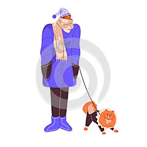 Sleepy woman walking dog in cute coat. People in winter outfit stroll puppy outdoors. Walker in sleeping cap leads pet