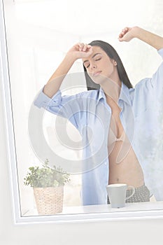 Sleepy woman at window