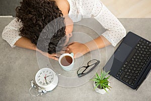 sleepy woman working from office