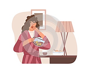 Sleepy woman yawning and drinking strong tea early in morning at home. Hard wakening of drowsy tired person. Female's