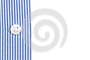 A sleeve of a blue striped shirt with a button on the white background