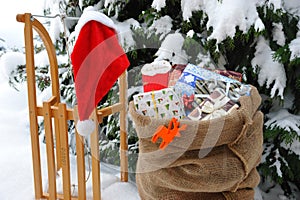 Sleigh with Christmas presents in the snow