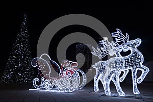 Sleighs and reindeer decorated with ice lamps