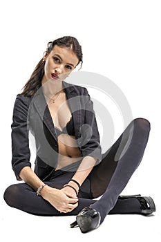 Slender brunette girl removes a business suit undressing