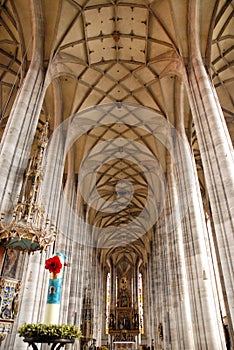 Slender columns and aisle of a large church in the town of Dinkelbur in Germany