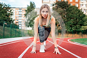 Slender girl getting ready to run.