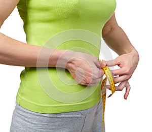 Slender woman measuring her waist