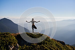 Slender woman meditating on fresh air.