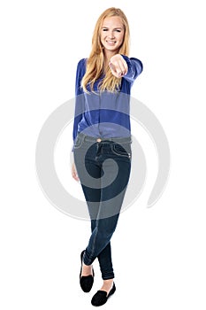 Slender woman pointing at the camera