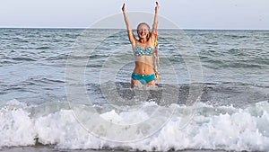 Slender young girl on the coast