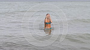 Slender young girl on the coast