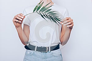 Slender young woman wearing blue high waist jeans