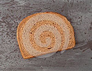 Slice of all natural stone ground whole wheat bread