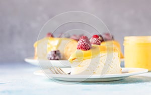 Slice of angel food cake with lemon curd and frozen berries raspberry and blackberry.