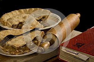 Slice of apple pie with fork.