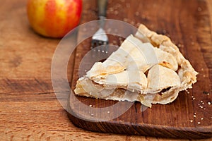 Slice of apple pie with heart shaped crust topping