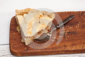 Slice of apple pie with heart shaped crust topping