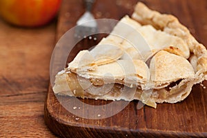 Slice of apple pie with heart shaped crust topping