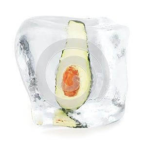 Slice Avocado with bone frozen in ice cube. Ice cube in front view, single ice cube isolated on white background. 3d