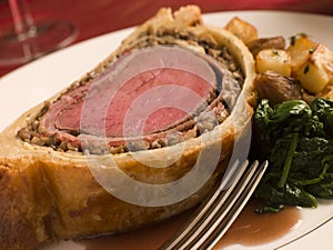 Slice of Beef Wellington with Spinach photo