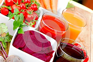 Slice of beet in bowl, beet juce, tomato juice and carrot juice, healthy drinks as strong antioxidants