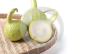 Slice bottle gourd fruit on basket isolated