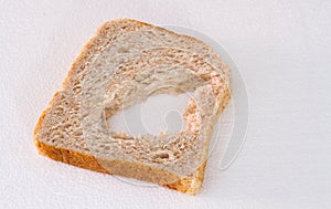Slice of bread with a chunk missing from it