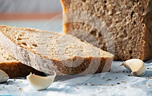 Slice of bread and garlic, close up. photo