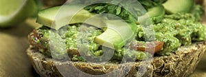 Slice of bread with guacamole made from avocado