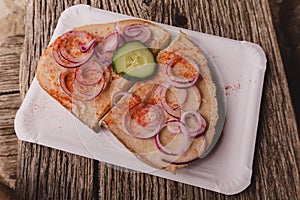 Slice of bread with lard and red onion photo