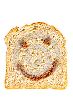 A slice of bread with nutella smile.