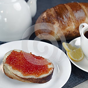 Slice of bread with red caviar