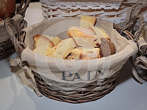 Slice of Bread Rolls and French Loaf inside Wicker Basket