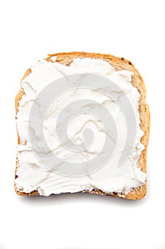 Slice of bread with sour cream spread on top