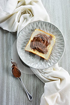 Slice of bread spread with hazelnut praline paste
