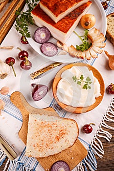 A slice of bread spread with lard