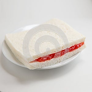 Slice of bread with strawberry jam