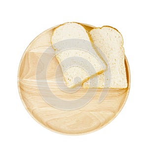 Slice of brown bread on wooden breadboard
