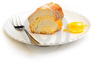 Slice of cake garnished with lemon peel