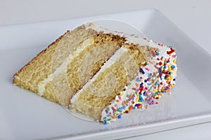 A slice of cake with sprinkles