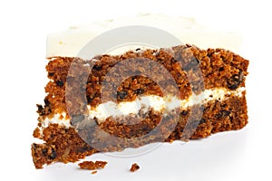 Slice of carrot cake with rich frosting.