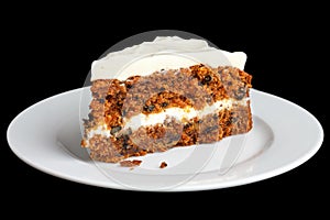 Slice of carrot cake with rich frosting.