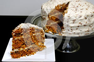 Slice of Carrot Cake with Whole Cake